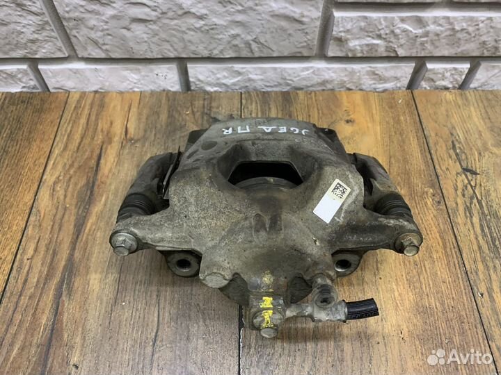 Орel Аstrа J Суппорт тормозной передний Правый