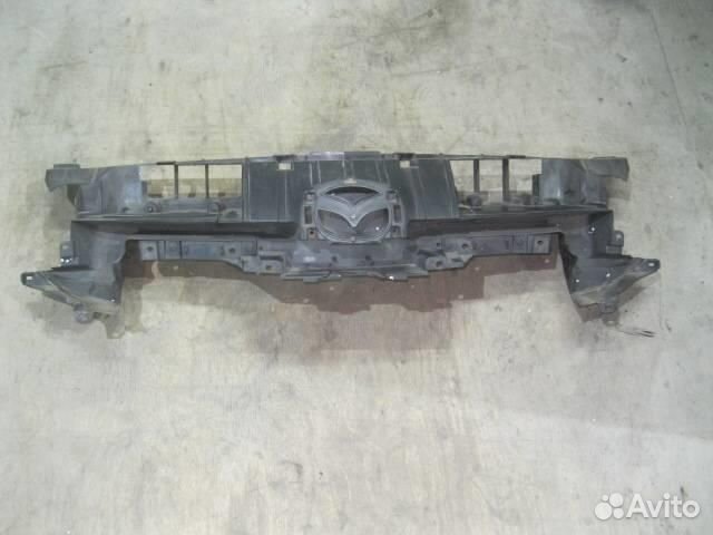 Кронштейн переднего бампера центральный от Mazda