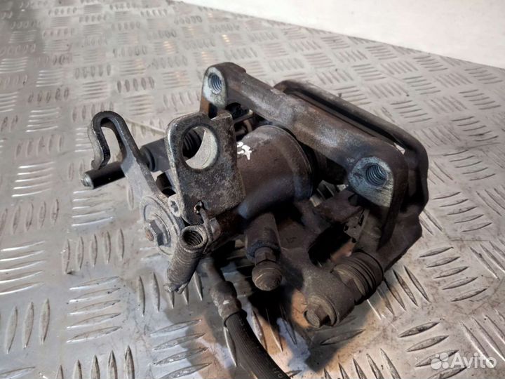 Суппорт задний правый Опель Астра J