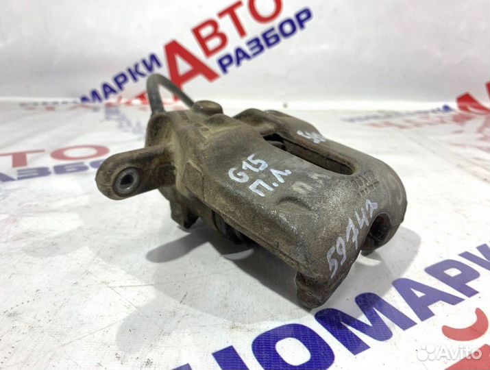 Суппорт тормозной передний левый Nissan Almera G15