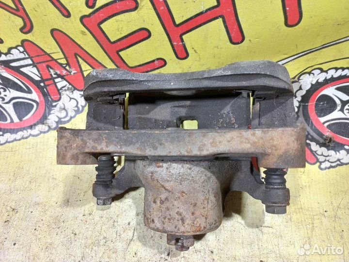 Суппорт тормозной передний левый Nissan Teana J31