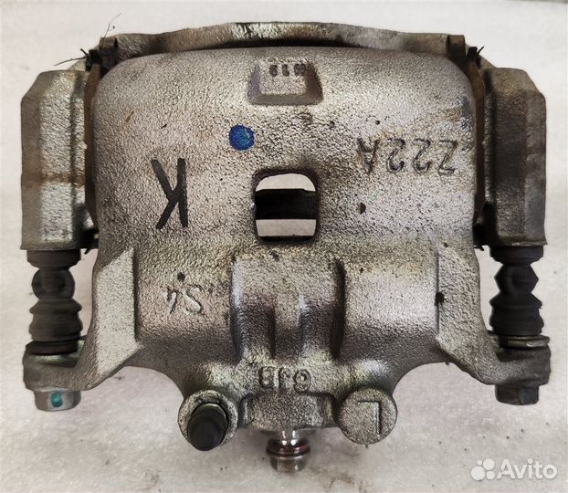 Суппорт тормозной передний левый Nissan Note E