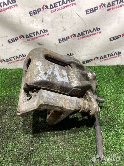 Суппорт тормозной передний левый Nissan Note E11