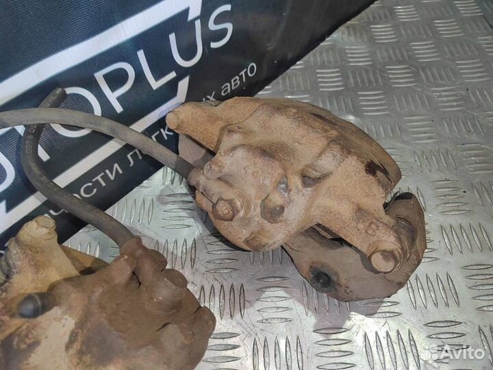 Тормозной суппорт передний Mitsubishi Lancer 9