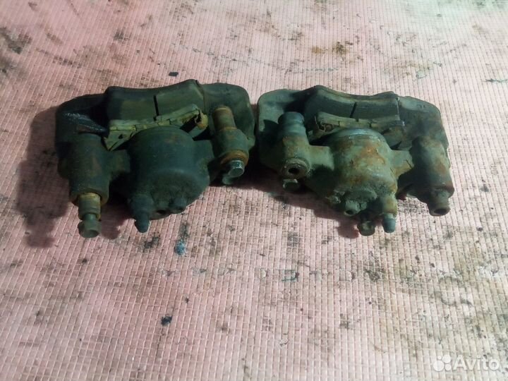 Суппорт тормозной передний Киа Рио 1