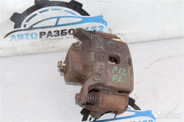 Суппорт тормозной передний левый Nissan Primera