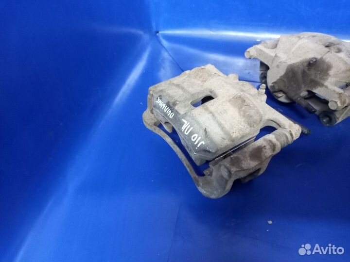 Суппорт тормозной передний Nissan Qashqai I рестай