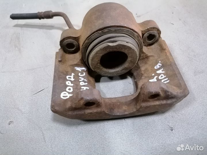 Суппорт тормозной задний правый Ford Taurus 1 1990