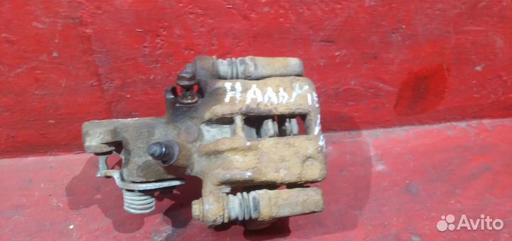 Суппорт задний левый Nissan Almera N16 Альмера