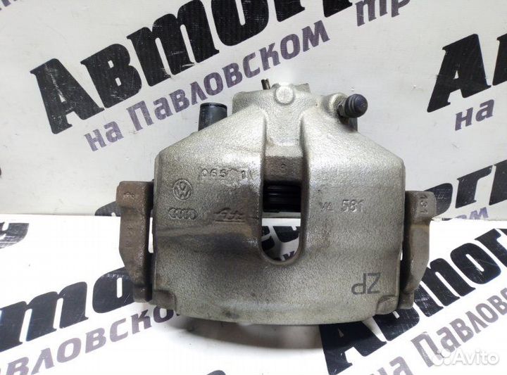 Суппорт тормозной передний левый Volkswagen Passat