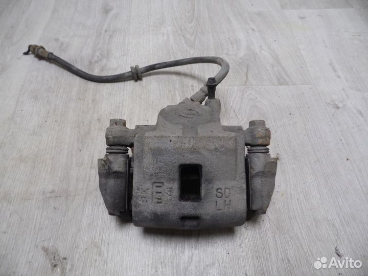 Суппорт тормозной передний левый Kia Spectra 2001