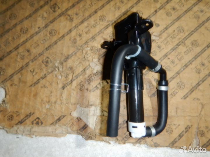 Форсунка омывателя фары левая Outlander XL