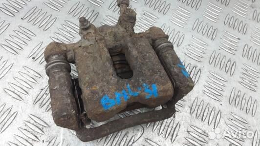 Суппорт тормозной задний левый toyota corolla E12