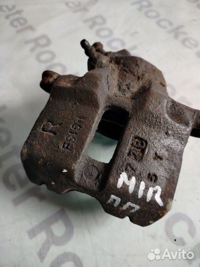 Суппорт тормозной передний левый Mitsubishi Mirage