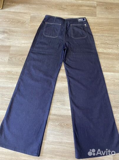 Джинсы клеш от бедра 44-46