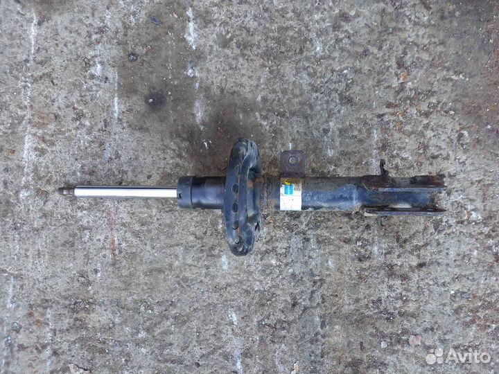 Стойка амортизатора передняя левая Nissan Note