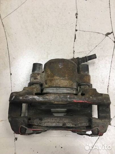 Суппорт тормозной передний левый Kia Shuma