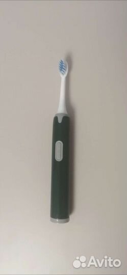 Электрическая зубная щетка