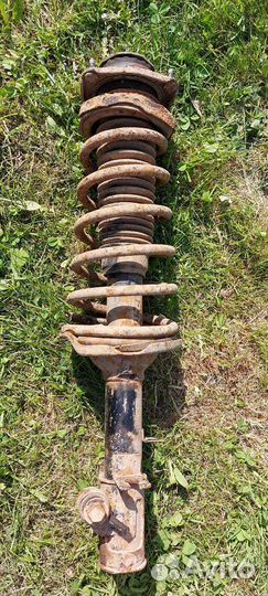 Стойка амортизатора задняя левая Kia Spectra