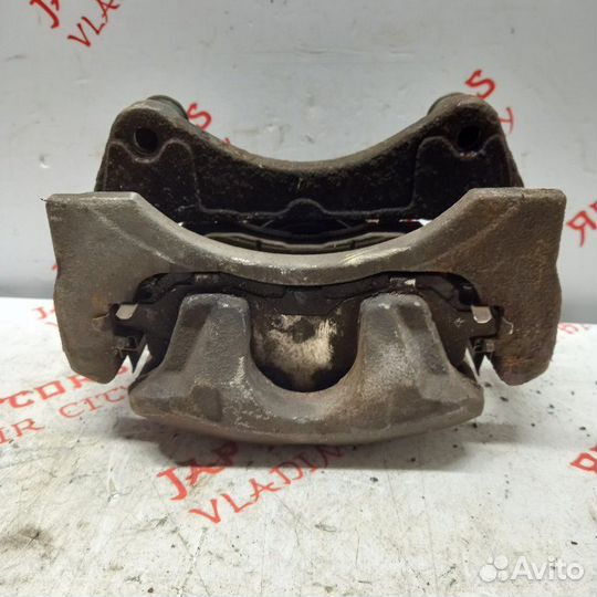 Суппорт тормозной передний левый Mitsubishi Lancer