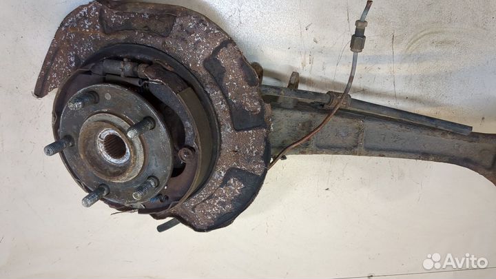 Ступица (кулак, цапфа) левая задняя Mitsubishi Outlander XL