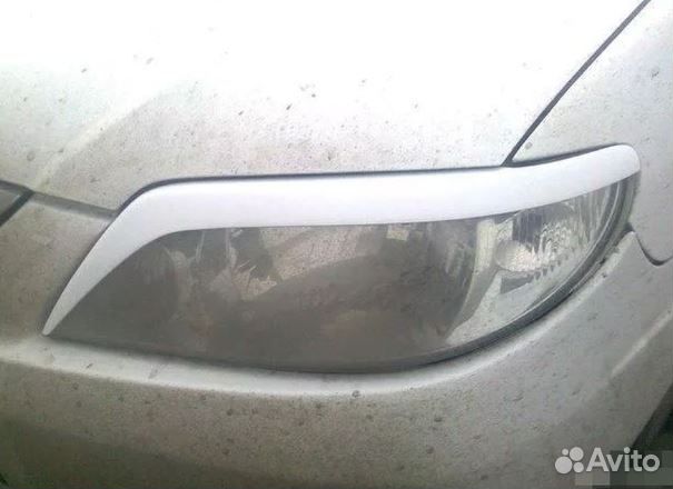 Реснички на фары mazda familia 2002