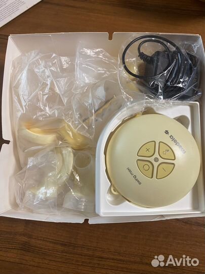 Молокоотсос medela swing maxi