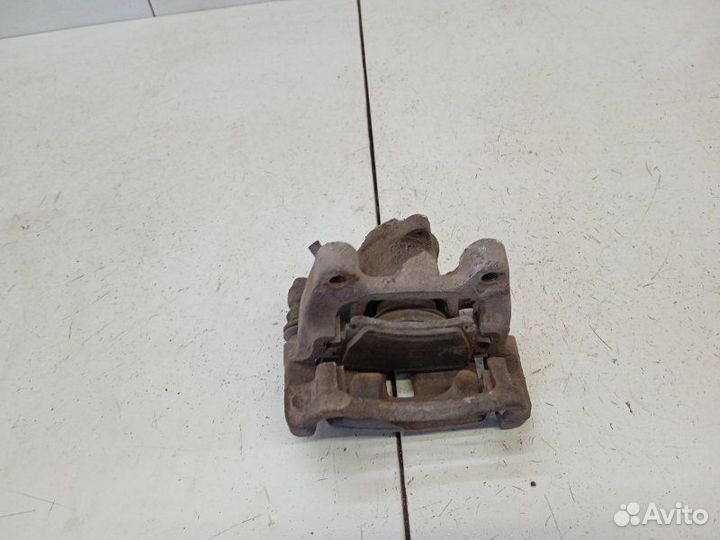 Суппорт задний левый Volkswagen Passat B6 2.0 2006