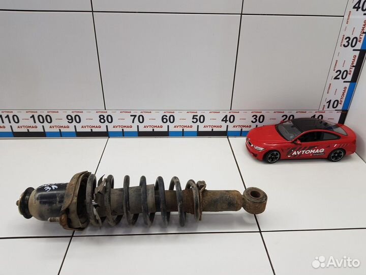 Амортизатор задний левый с пружиной