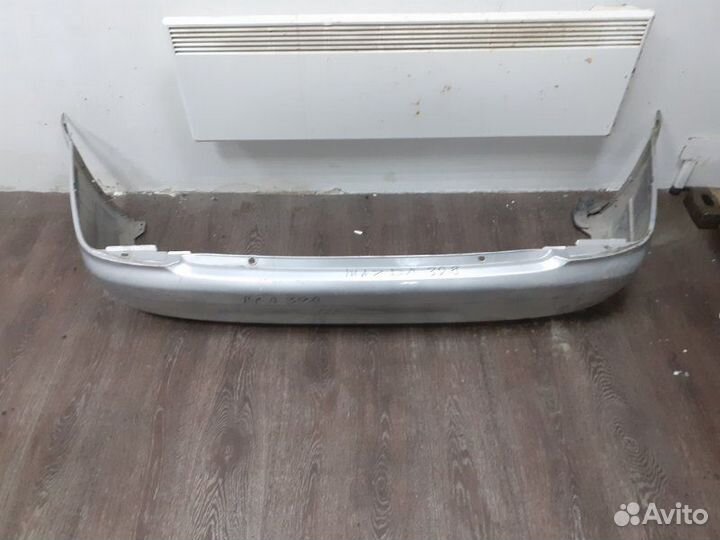 Бампер задний Mazda 323