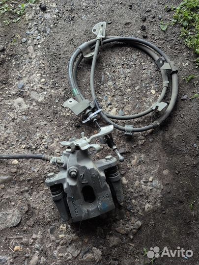 Суппорт тормозной задний Toyota corolla 150