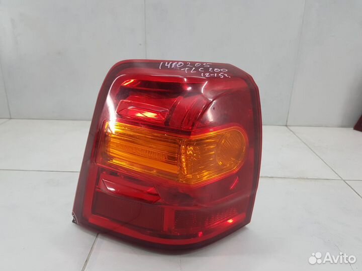 Фонарь задний левый наружный Toyota Land Cruiser