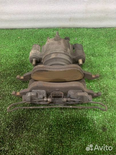 Суппорт тормозной передний Ford Focus седан 1.8