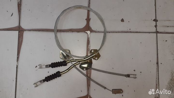 Трос стояночногно тормоза Волга газ24