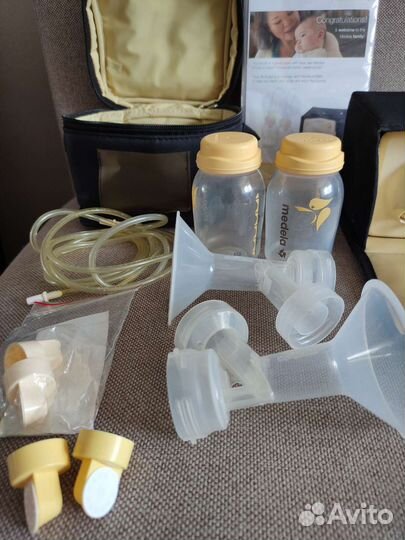 Молокоотсос medela электрический