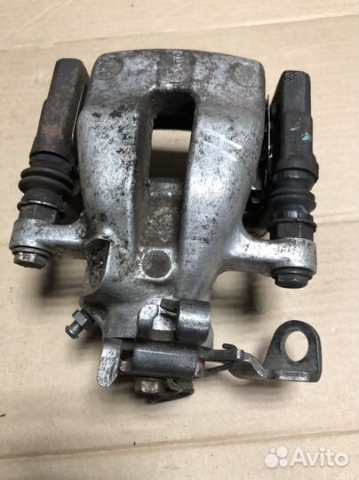 Суппорт задний правый Опель Астра Аш