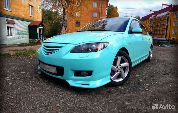 Клыки переднего бампера Мазда 3 bk