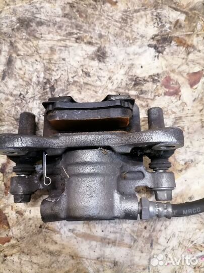 Суппорт задний правый Mitsubishi Lancer X