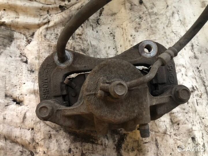 Суппорт тормозной передний левый Kia Sportage 3