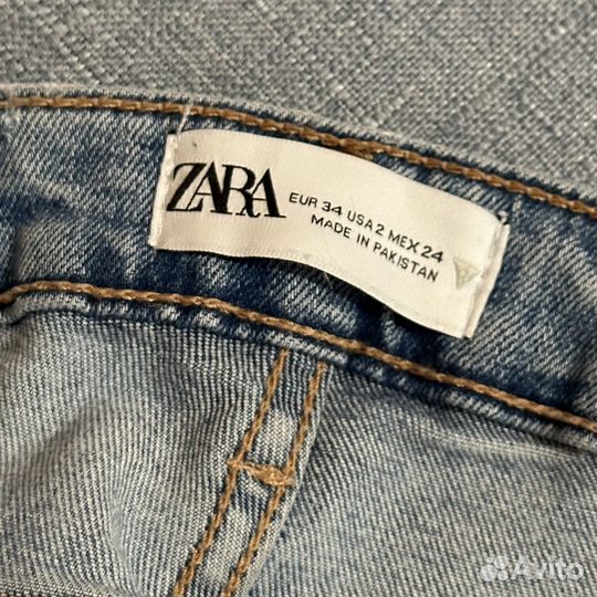 Джинсы голубые zara с разрезами 34