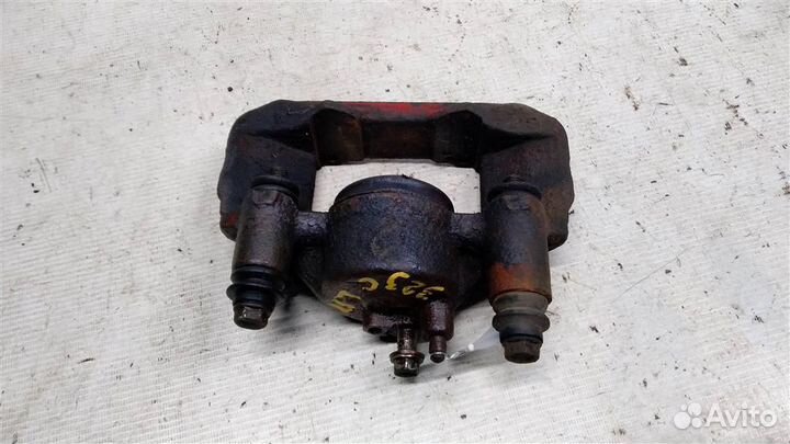 Суппорт передний левый Mazda 323 С ва 97-00г