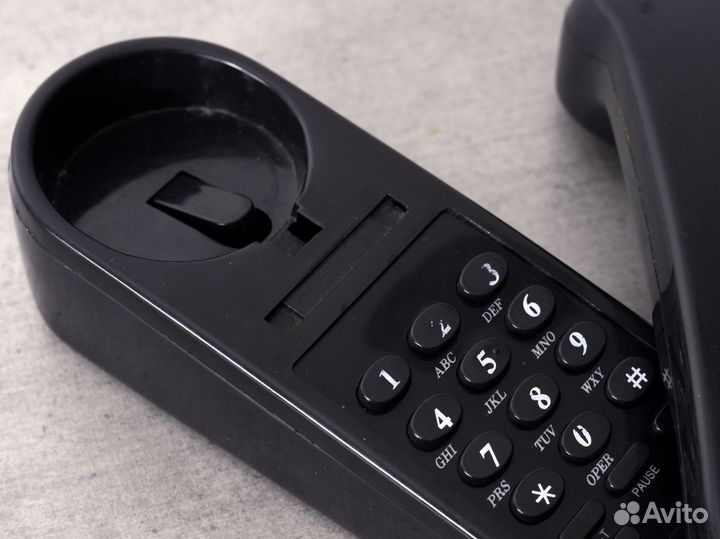 Стационарный телефон с кнопками на детали