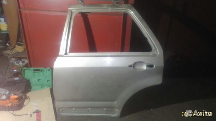 Дверь задняя левая SRX 03-10