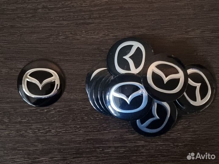 Эмблемы. Наклейки на колпачки литых дисков Mazda