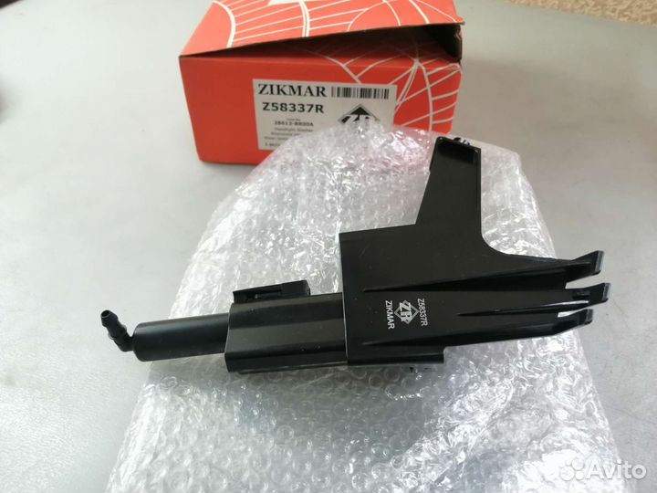 Форсунка омывателя фар левая Nissan Qashqai J10