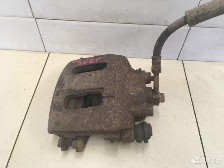 Суппорт передний левый Grand Cherokee (ZJ) 1993-1998