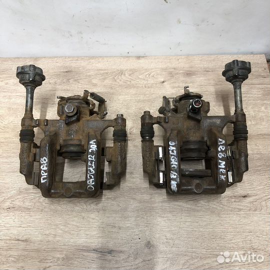 Суппорт задний Opel Astra j Gtc мех ручник