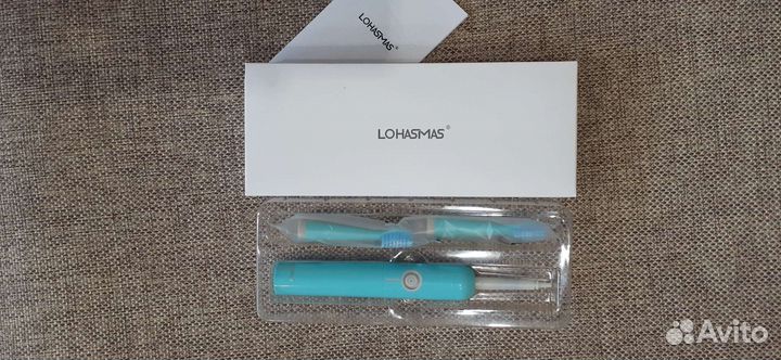 Электрическая зубная щетка