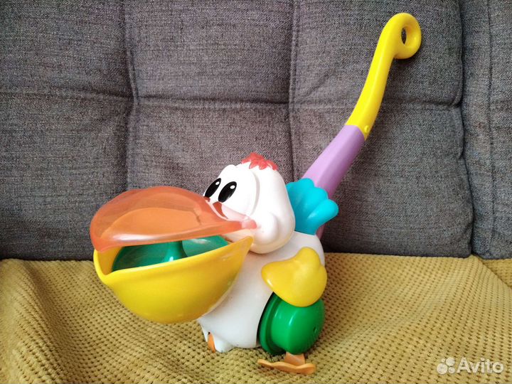 Игрушка каталка с ручкой