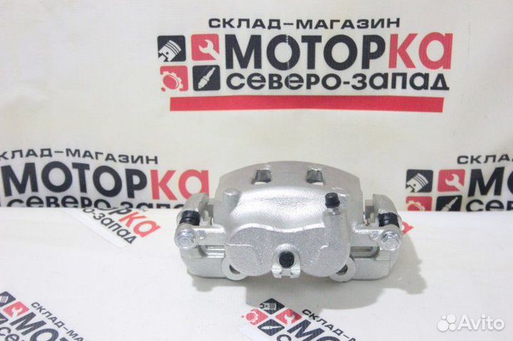 Суппорт тормозной передний левый Nissan Terrano